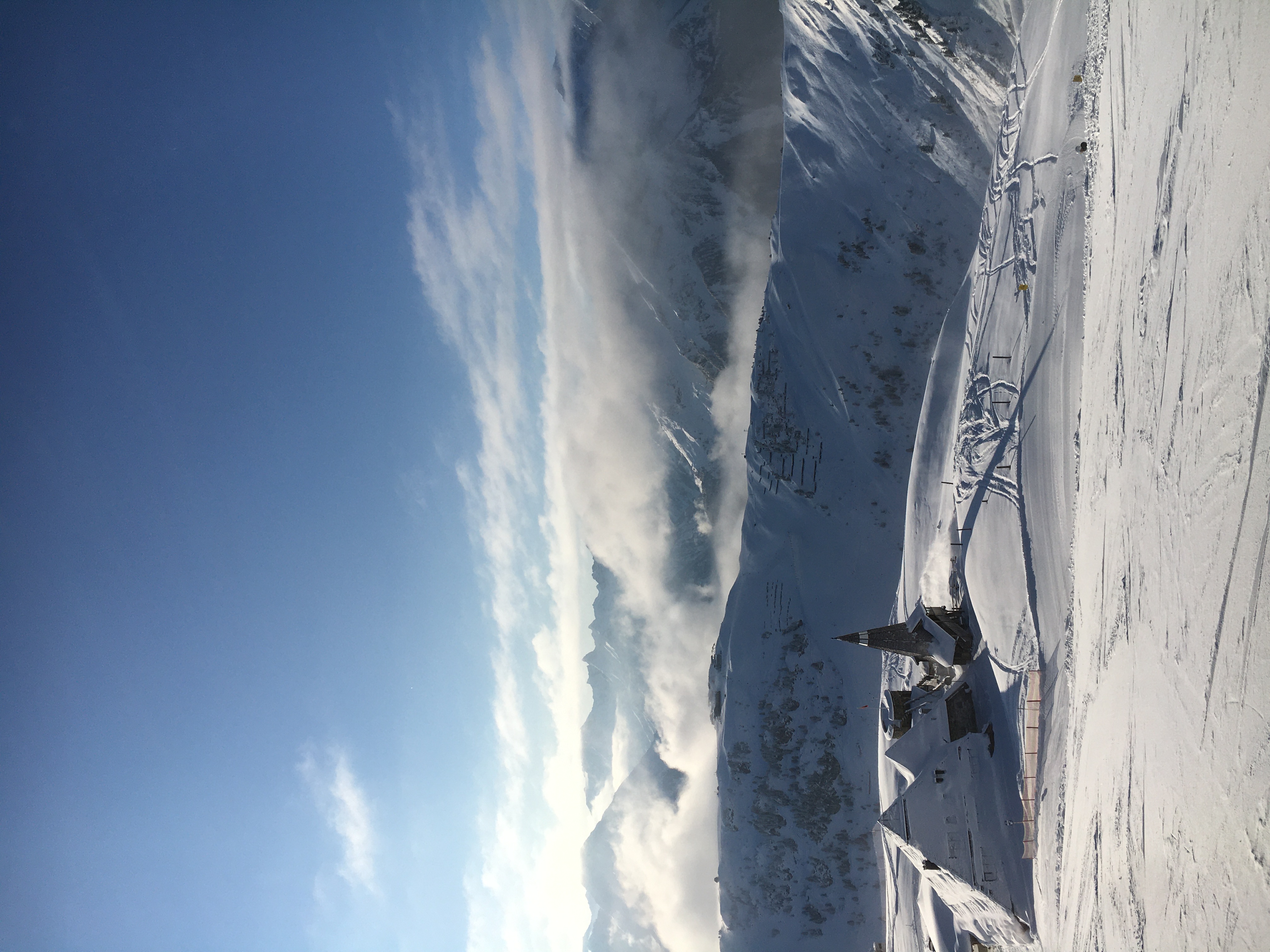 An open journal with brass compass, lit by warm window light